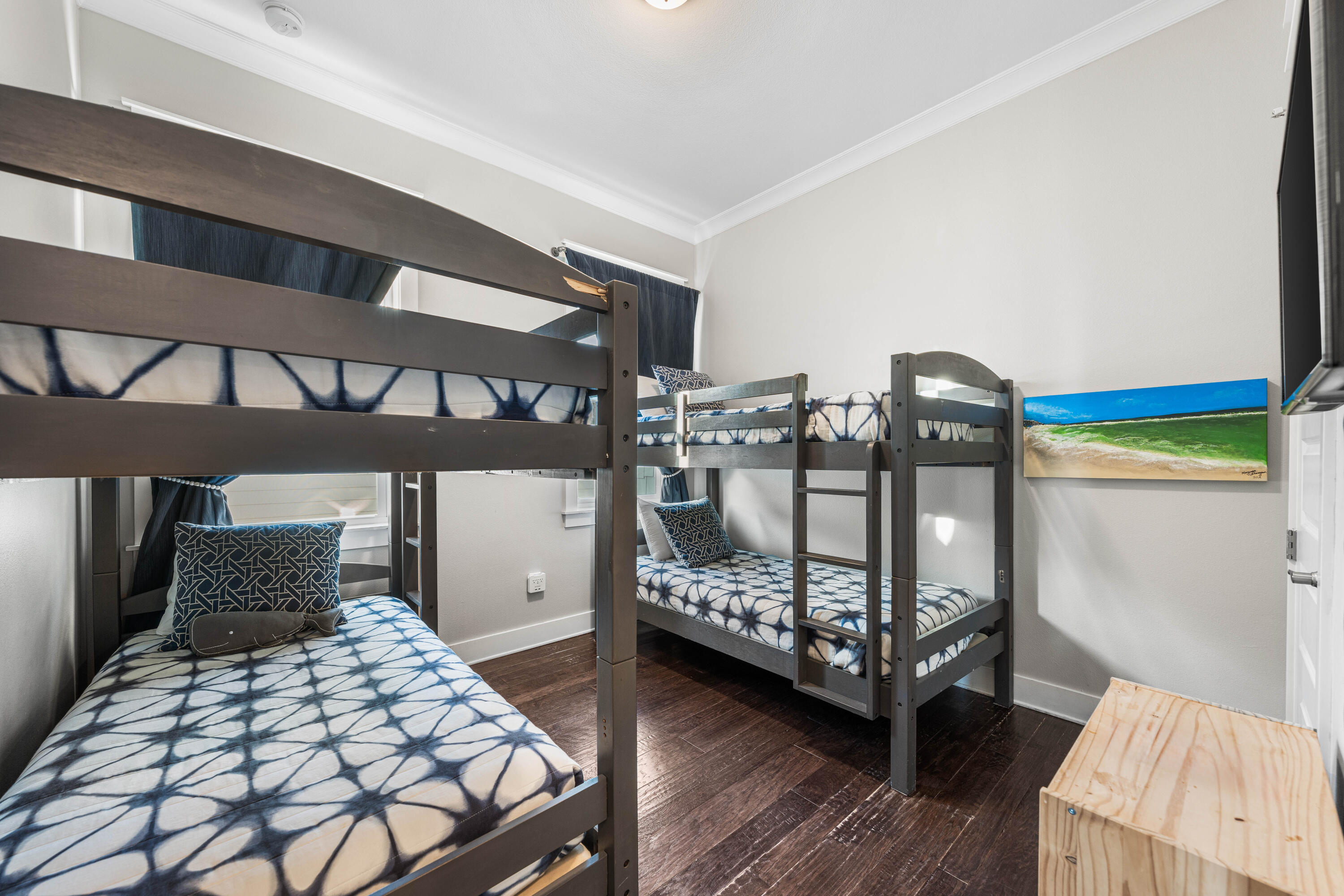 91 Milestone Dr Inlet Beach, Unit B Inlet Beach, FL 32461 - Photo 27 of 51 a bedroom with a bed and wooden floor