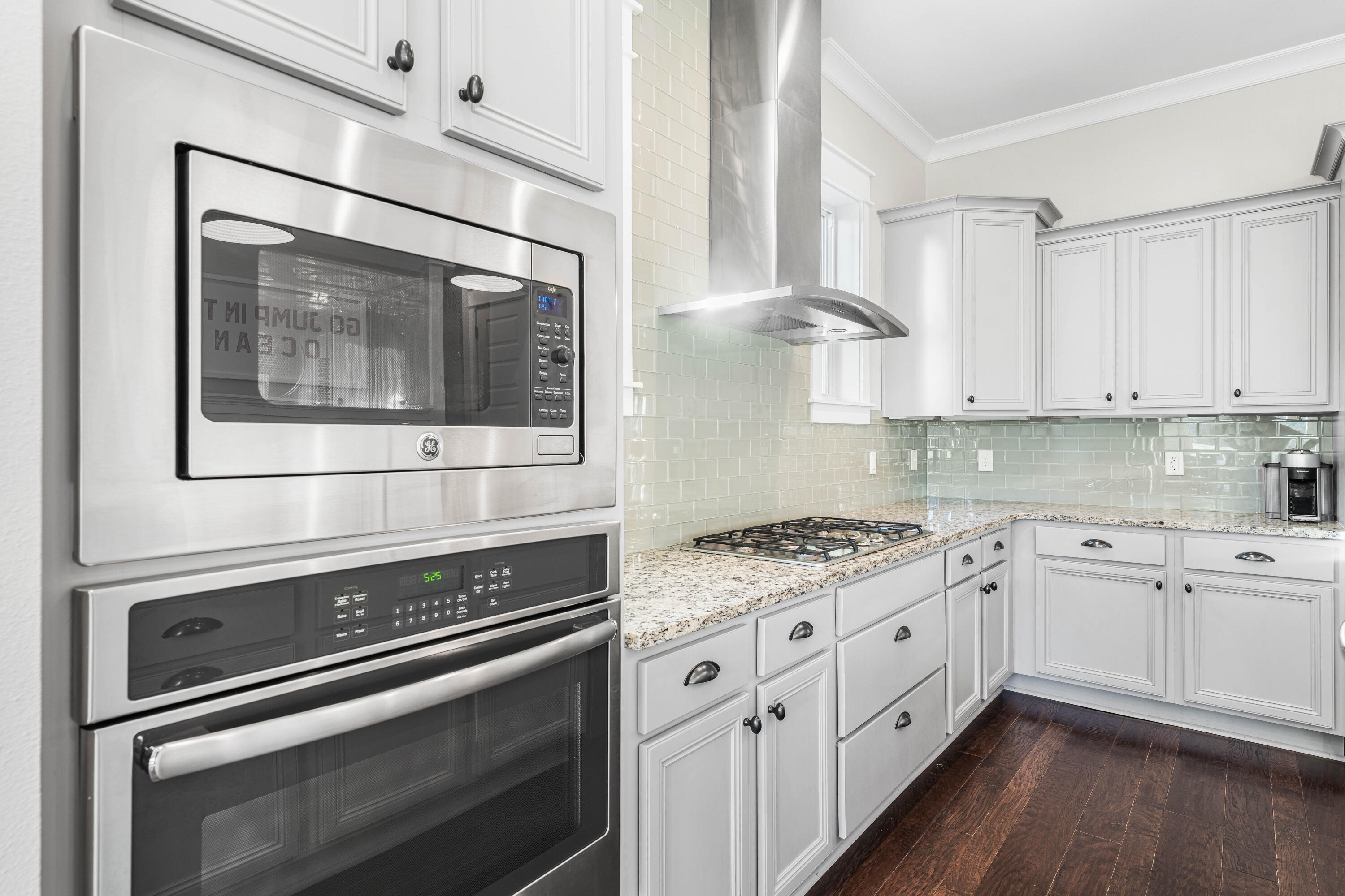 91 Milestone Dr Inlet Beach, Unit B Inlet Beach, FL 32461 - Photo 7 of 51 a kitchen with stainless steel appliances granite countertop a stove and a microwave