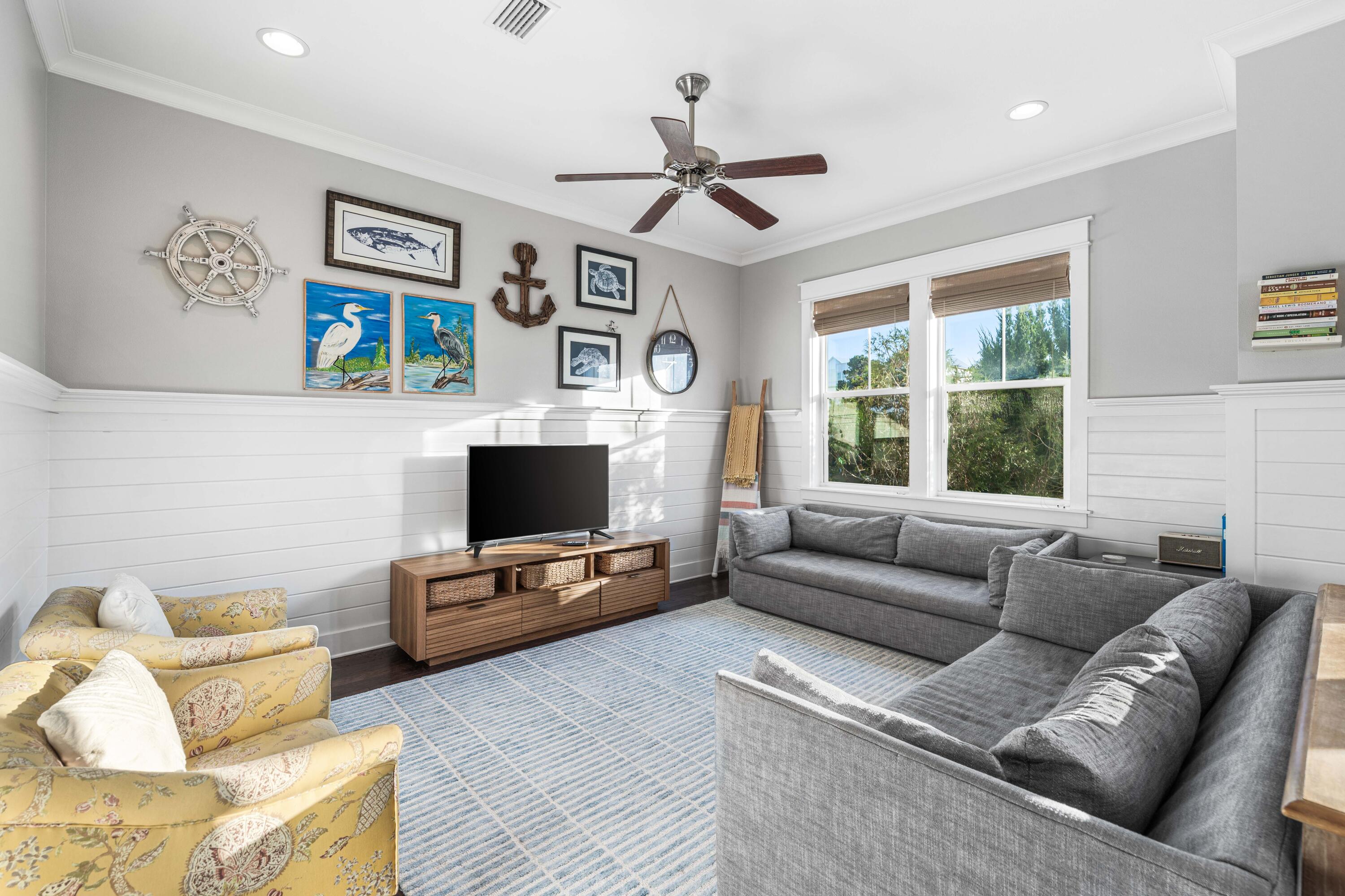 91 Milestone Dr Inlet Beach, Unit B Inlet Beach, FL 32461 - Photo 8 of 51 a living room with furniture a window and a flat screen tv