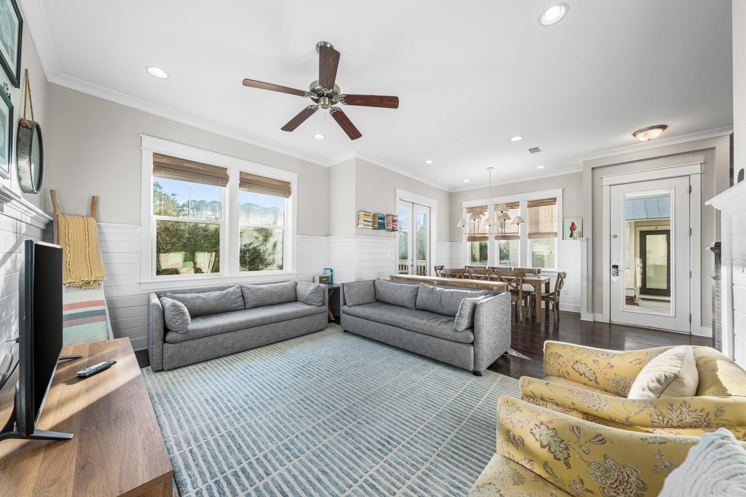 91 Milestone Dr Inlet Beach, Unit B Inlet Beach, FL 32461 - Photo 9 of 51 a living room with furniture and a large window
