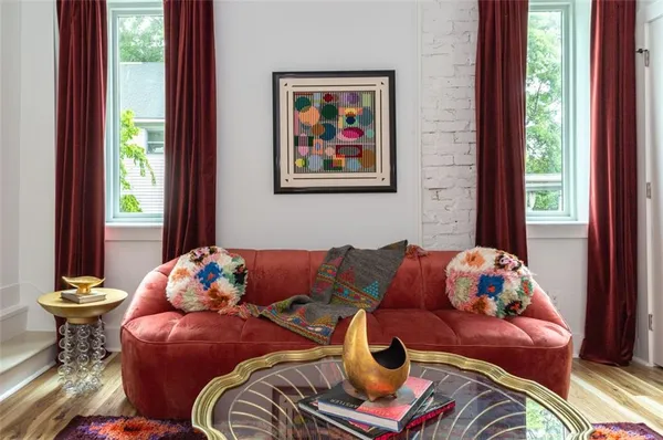 a living room with furniture and a window