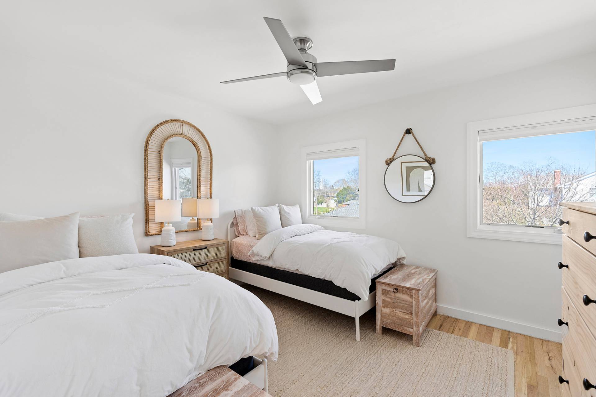 3004 Mitchell Road Westhampton Beach, NY 11978 - Photo 10 of 24 a bedroom with two beds and a window