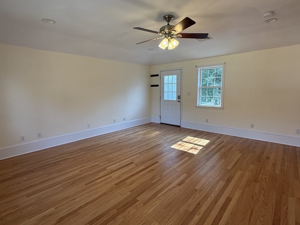 20 Alma Road Burlington, MA 01803 - Photo 13 of 26 an empty room with wooden floor and windows
