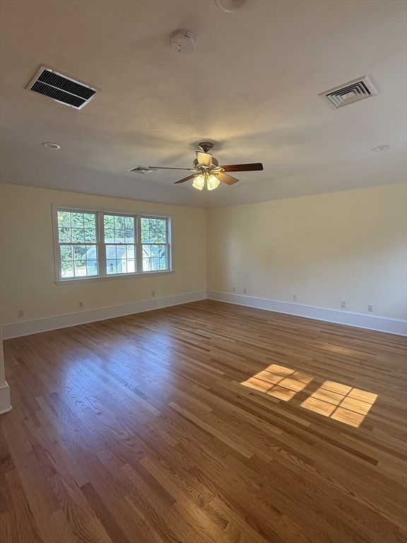 20 Alma Road Burlington, MA 01803 - Photo 14 of 26 a view of an empty room with wooden floor and a window