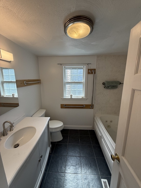 20 Alma Road Burlington, MA 01803 - Photo 17 of 26 a bathroom with a sink a toilet and bathtub