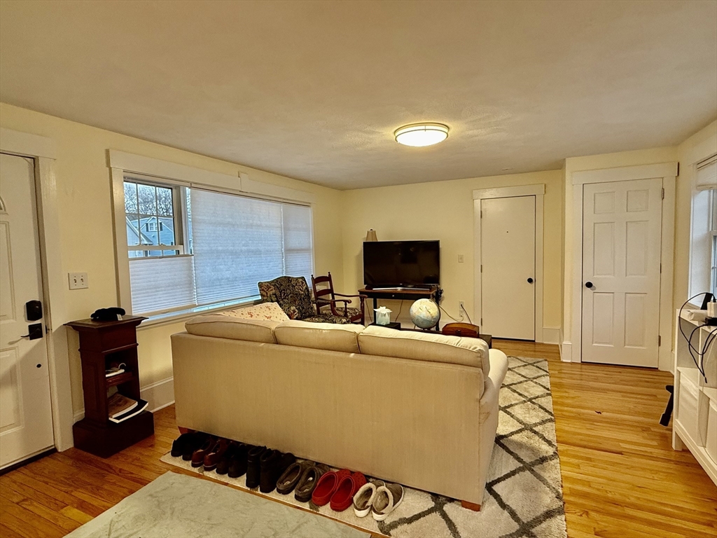 20 Alma Road Burlington, MA 01803 - Photo 4 of 26 a living room with furniture and a flat screen tv