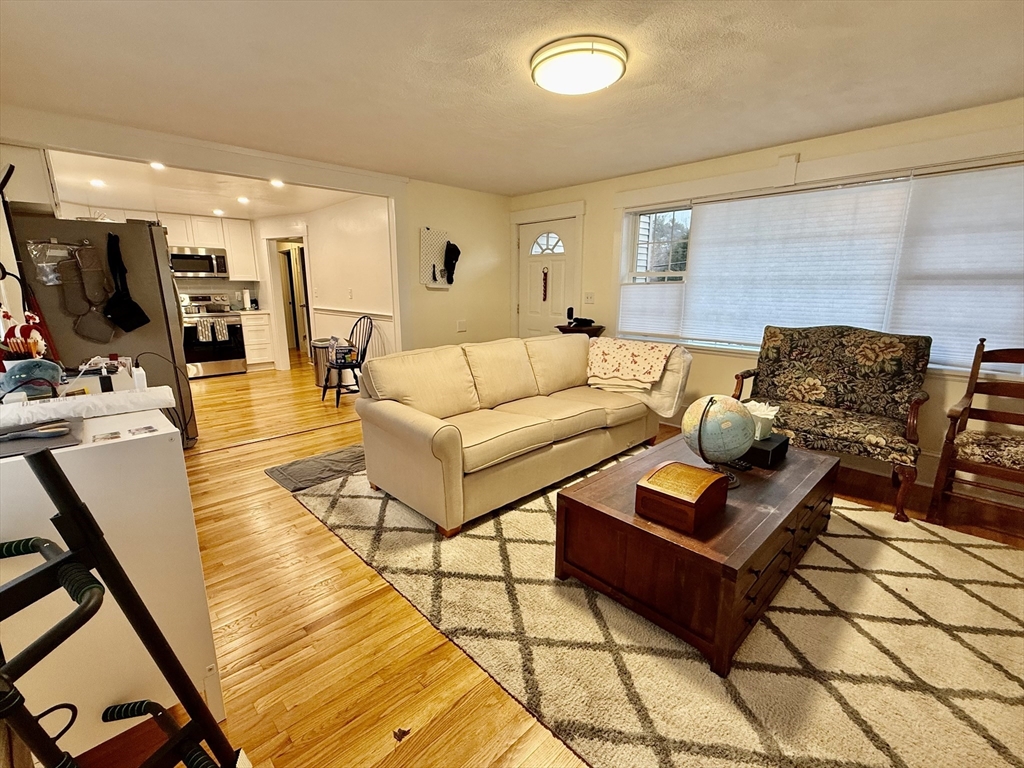 20 Alma Road Burlington, MA 01803 - Photo 5 of 26 a living room with furniture and a table