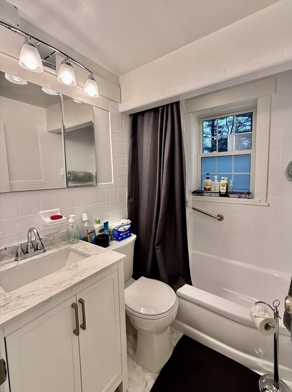20 Alma Road Burlington, MA 01803 - Photo 6 of 26 a bathroom with a sink a toilet and a mirror