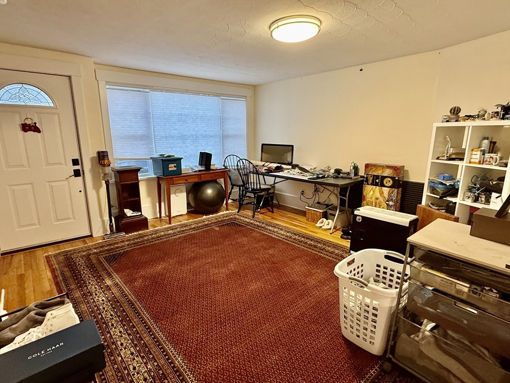 20 Alma Road Burlington, MA 01803 - Photo 7 of 26 a living room with furniture and a flat screen tv