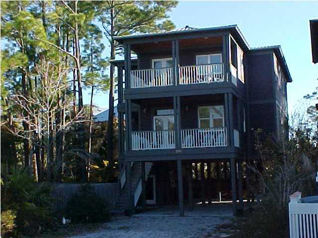 299 Defuniak Street Santa Rosa Beach, FL 32459 - Photo 1 of 16 a front view of a house with a yard