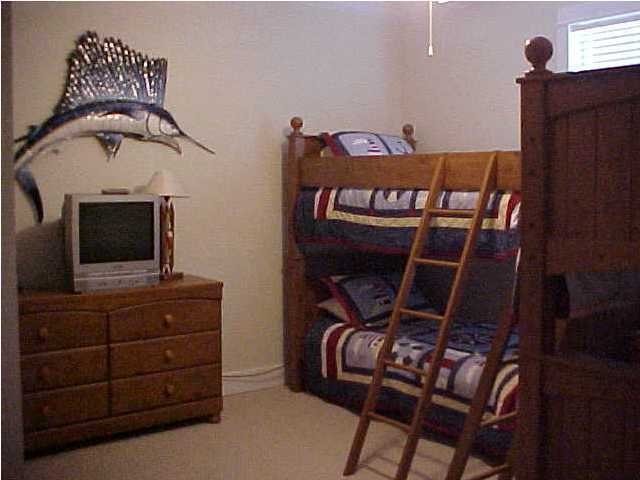 299 Defuniak Street Santa Rosa Beach, FL 32459 - Photo 16 of 16 a bedroom with a bed and furniture