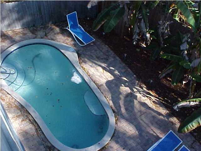 299 Defuniak Street Santa Rosa Beach, FL 32459 - Photo 4 of 16 a view of a swimming pool with outdoor seating