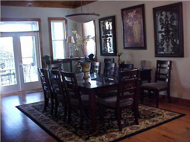 299 Defuniak Street Santa Rosa Beach, FL 32459 - Photo 7 of 16 a view of a a dining room with furniture window and wooden floor