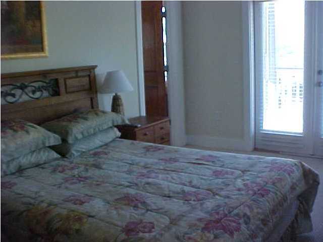 299 Defuniak Street Santa Rosa Beach, FL 32459 - Photo 9 of 16 a bedroom with a bed and a window