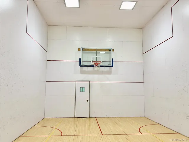 a dining room with furniture and a potted plant