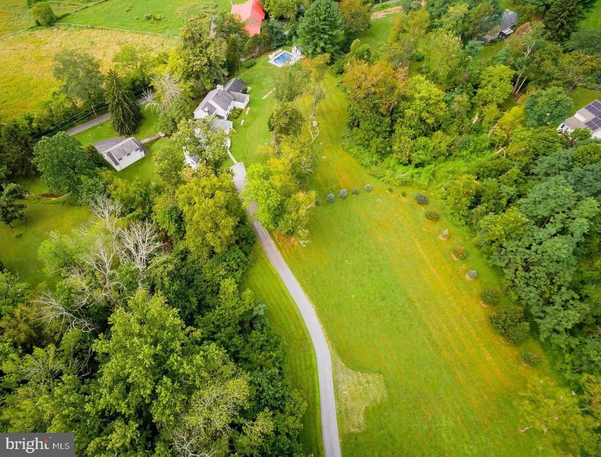 908 Lincoln Road Phoenixville, PA 19460 - Photo 20 of 26 Serene countryside retreat with lush greenery.