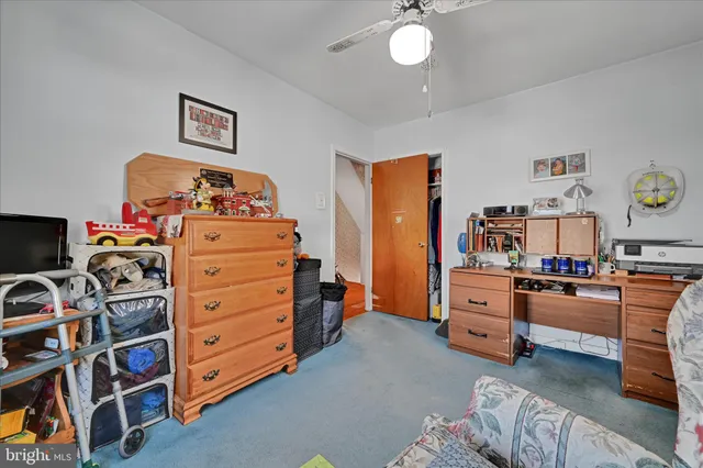 a bedroom with a bed and furniture