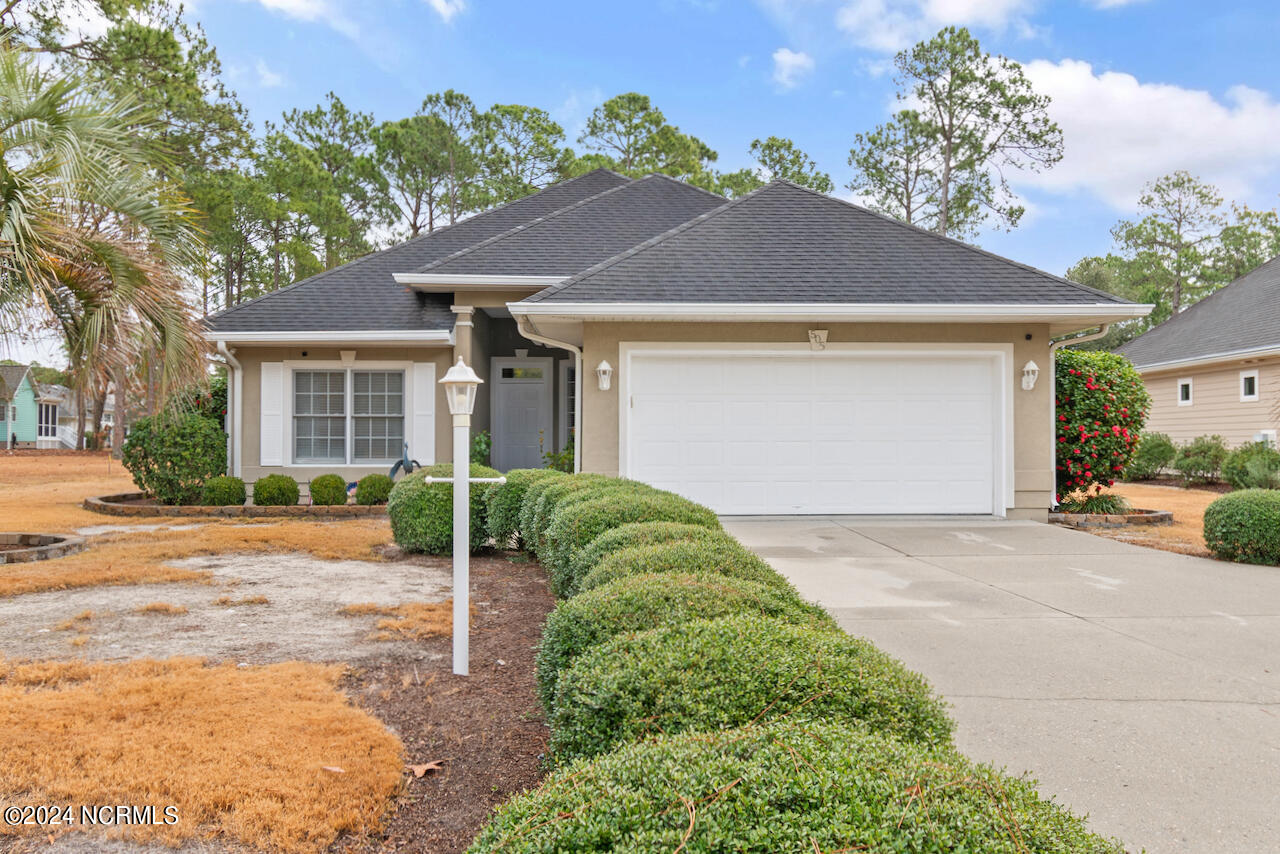 505 Planter's Ridge Drive Sunset Beach, NC 28468 - Photo 1 of 47 Lovely front of home with long driveway for multi car parking