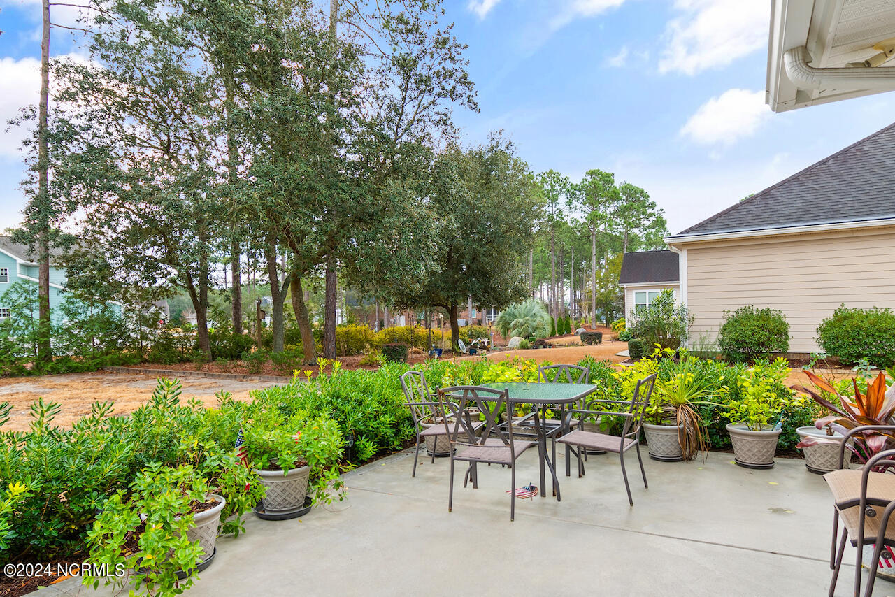 505 Planter's Ridge Drive Sunset Beach, NC 28468 - Photo 36 of 47 oversized concrete patio in the large yard