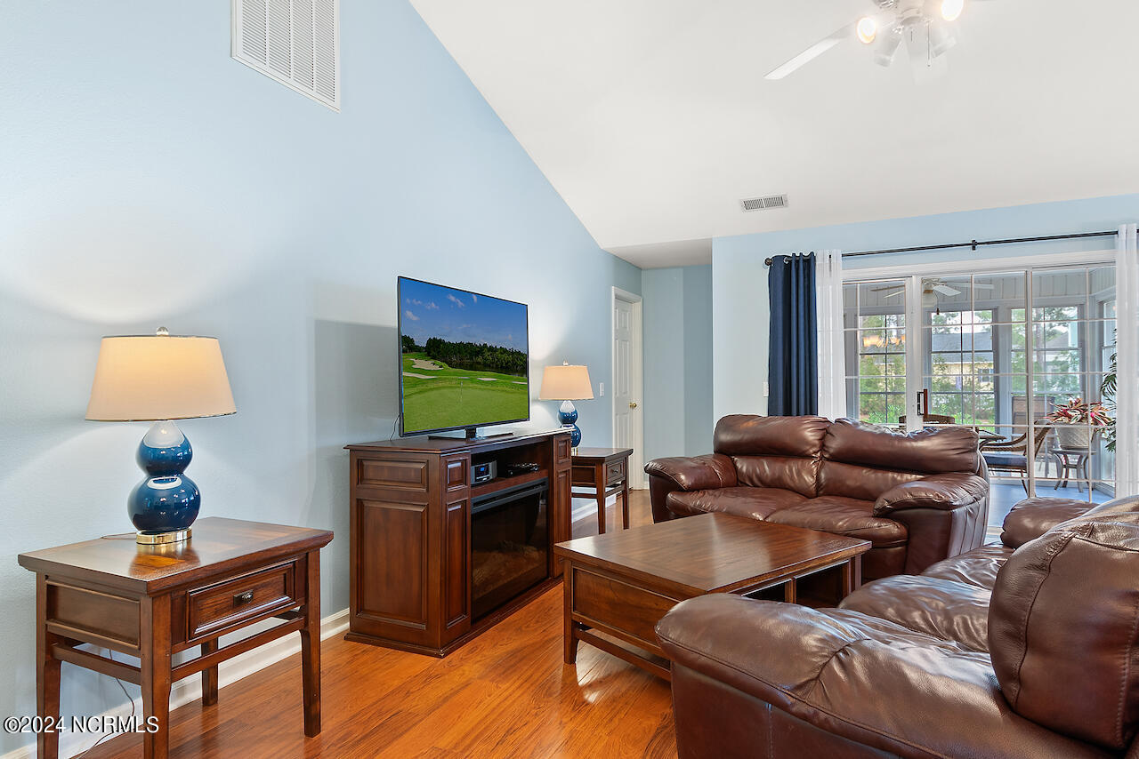 505 Planter's Ridge Drive Sunset Beach, NC 28468 - Photo 9 of 47 vaulted ceilings, cool and calm decor. Ceiling fan and tasteful flooring