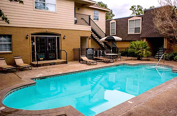 a view of a house with swimming pool