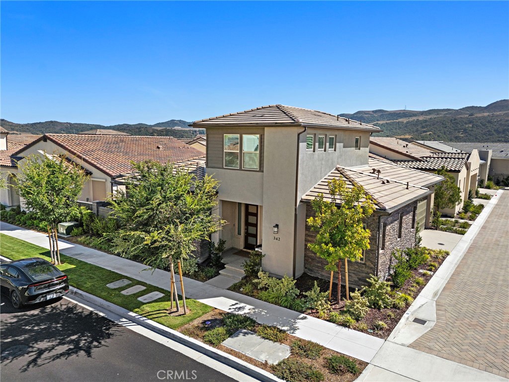 342 Sunrise Road Rancho Mission Viejo, CA 92694 - Photo 1 of 1 a front view of a house with a garden
