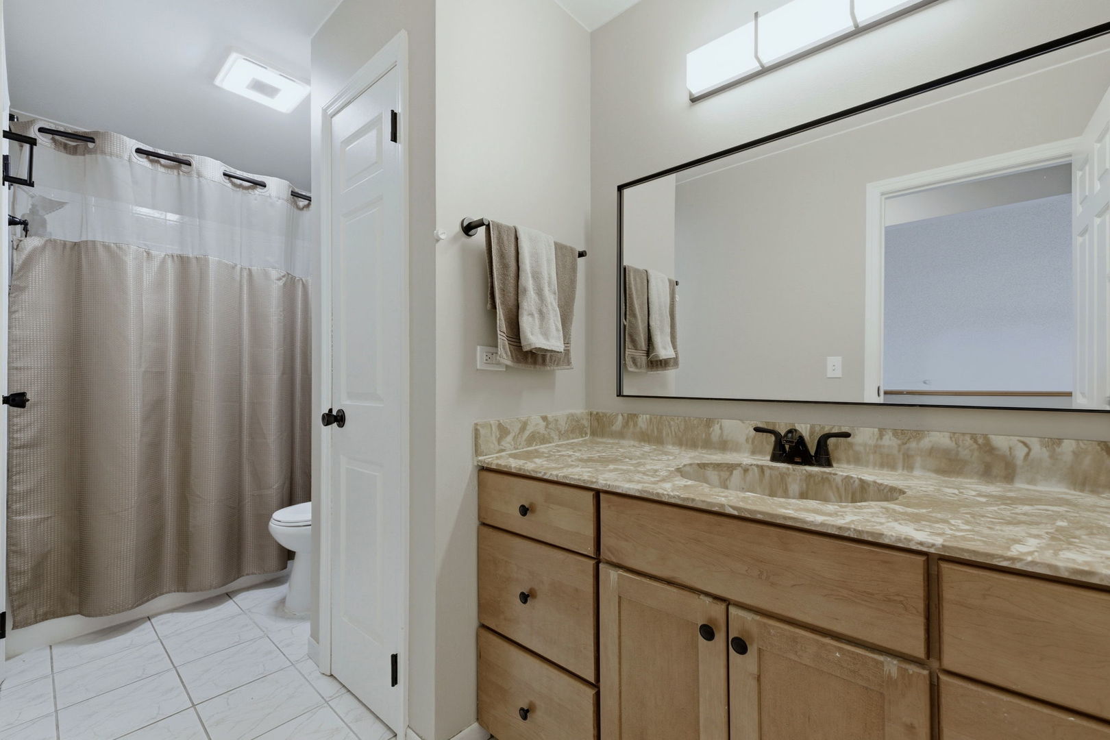 345 Redwing Drive Bolingbrook, IL 60440 - Photo 12 of 16 a bathroom with a granite countertop sink toilet and shower
