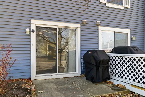 a couple of chairs sitting in front of a house