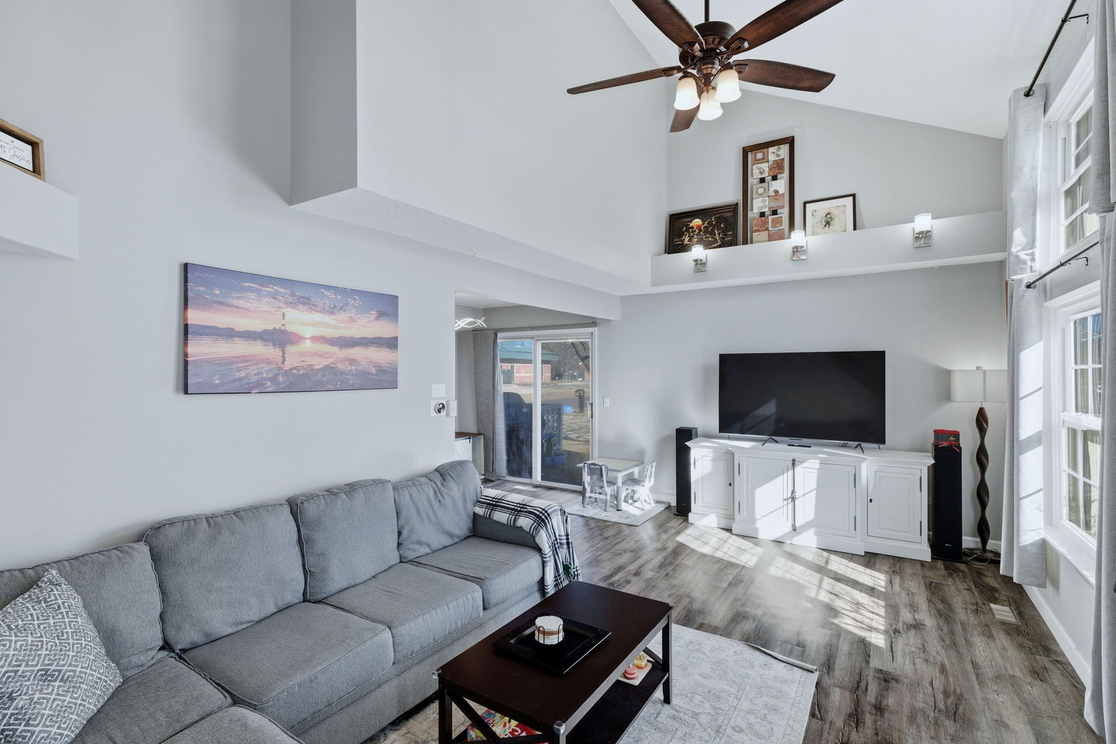 345 Redwing Drive Bolingbrook, IL 60440 - Photo 2 of 16 a living room with furniture and a flat screen tv