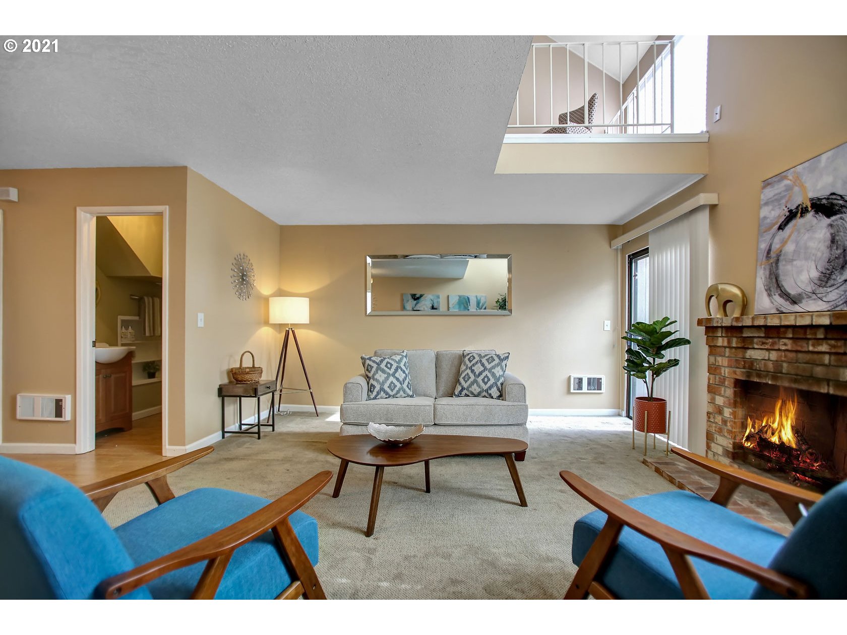 10237 Southwest Denney Road Beaverton, OR 97008 - Photo 11 of 32 a living room with furniture a fireplace and a table