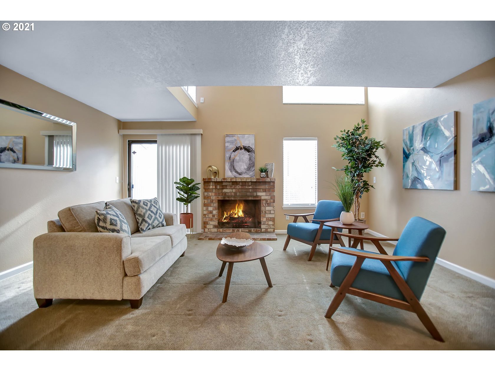 10237 Southwest Denney Road Beaverton, OR 97008 - Photo 12 of 32 a living room with furniture and a fireplace