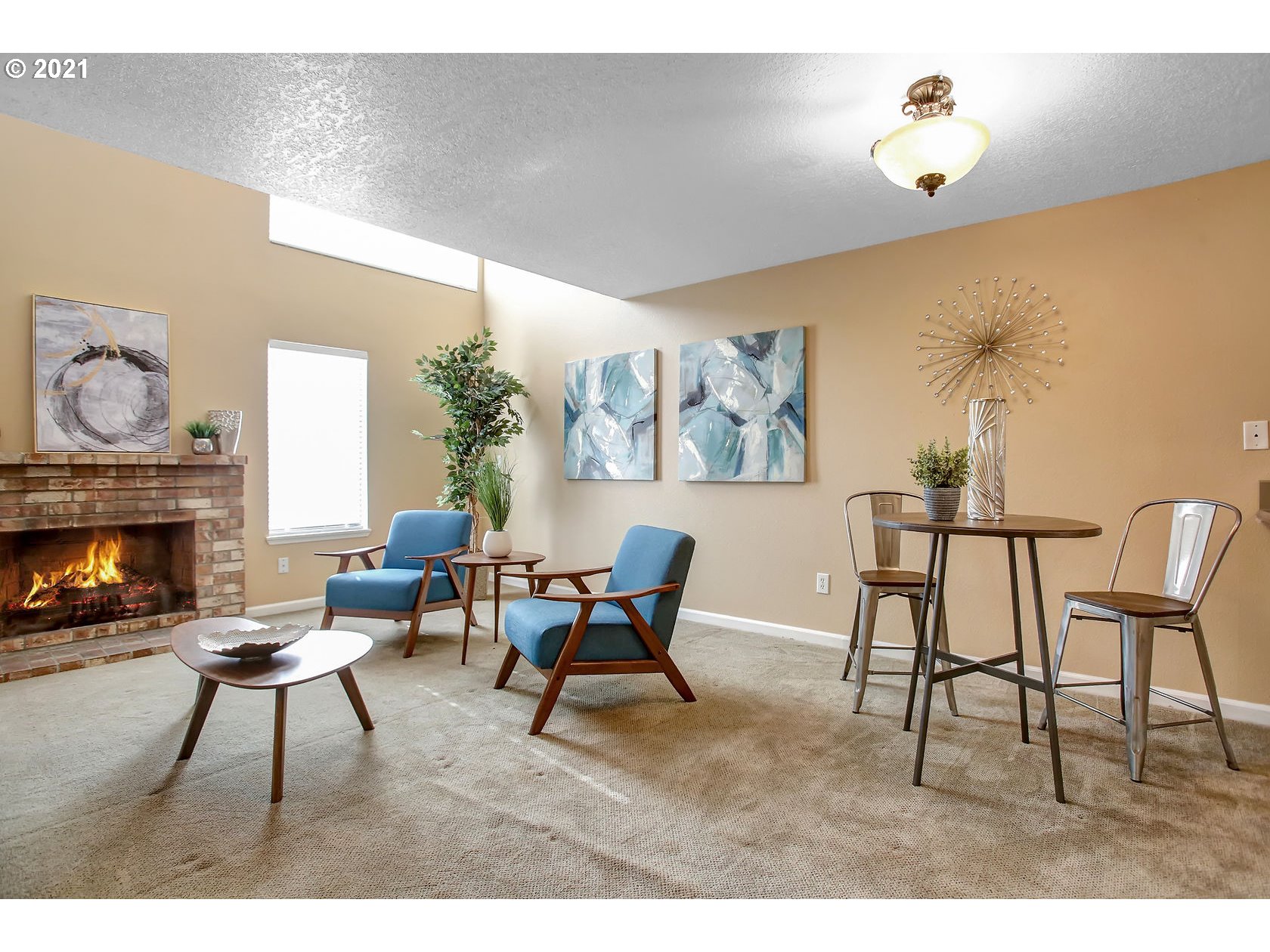 10237 Southwest Denney Road Beaverton, OR 97008 - Photo 13 of 32 a living room with furniture and a fireplace