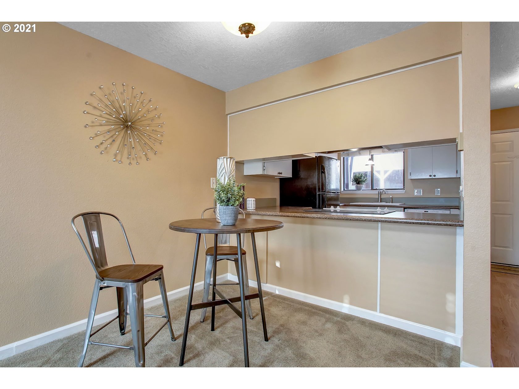 10237 Southwest Denney Road Beaverton, OR 97008 - Photo 15 of 32 a kitchen with a table and chairs