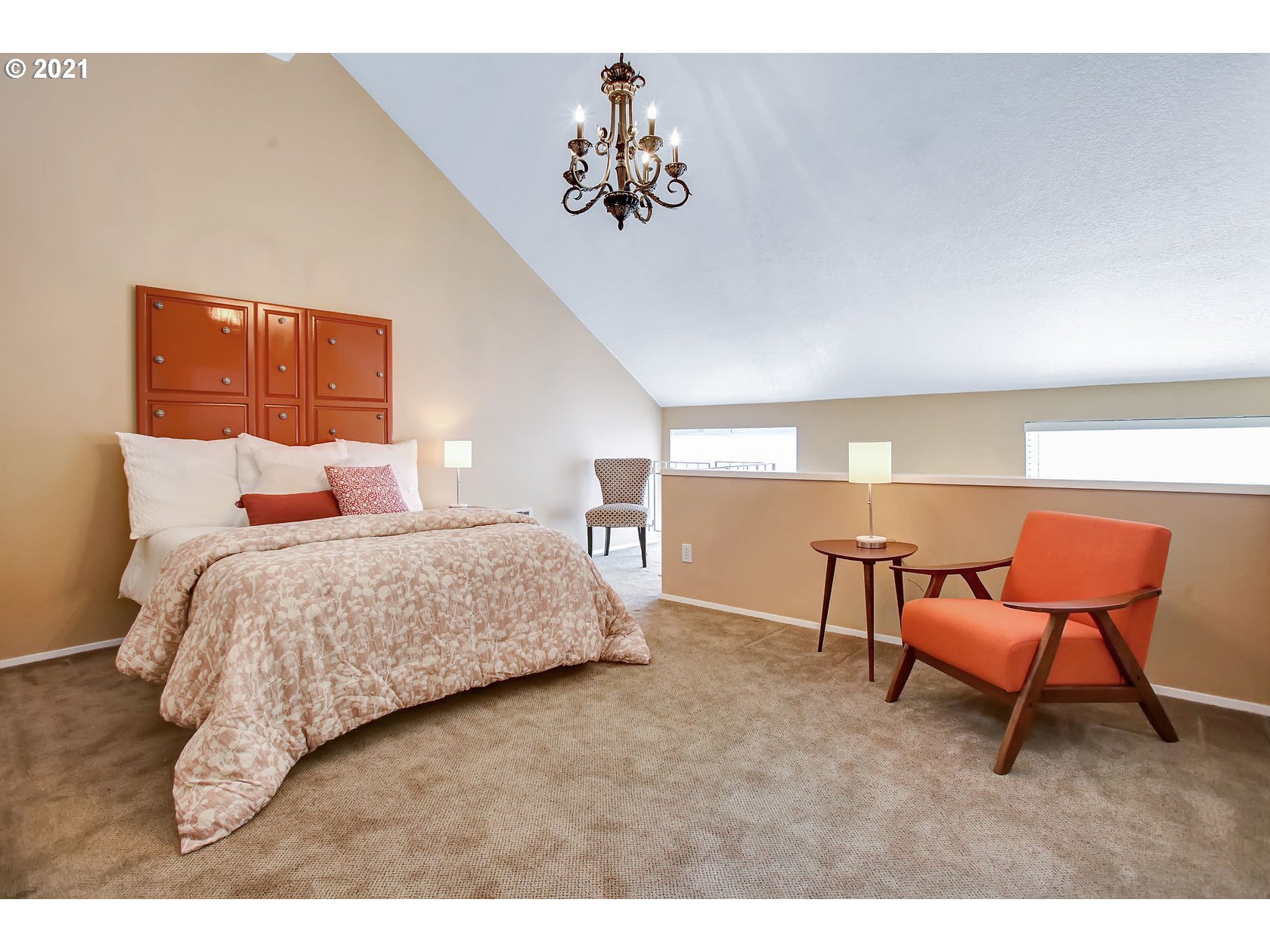 10237 Southwest Denney Road Beaverton, OR 97008 - Photo 20 of 32 a bedroom with a bed a chair and a chandelier