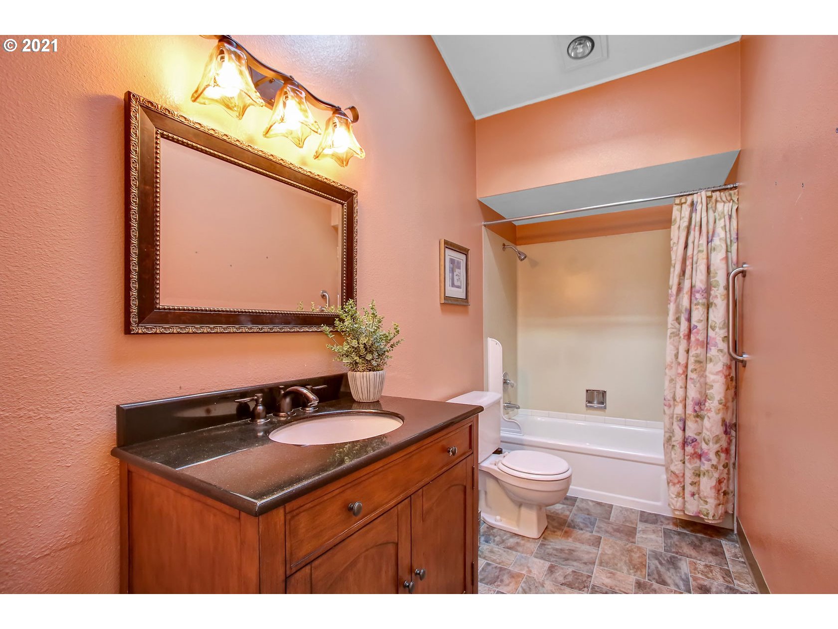 10237 Southwest Denney Road Beaverton, OR 97008 - Photo 23 of 32 a bathroom with a sink vanity mirror and toilet