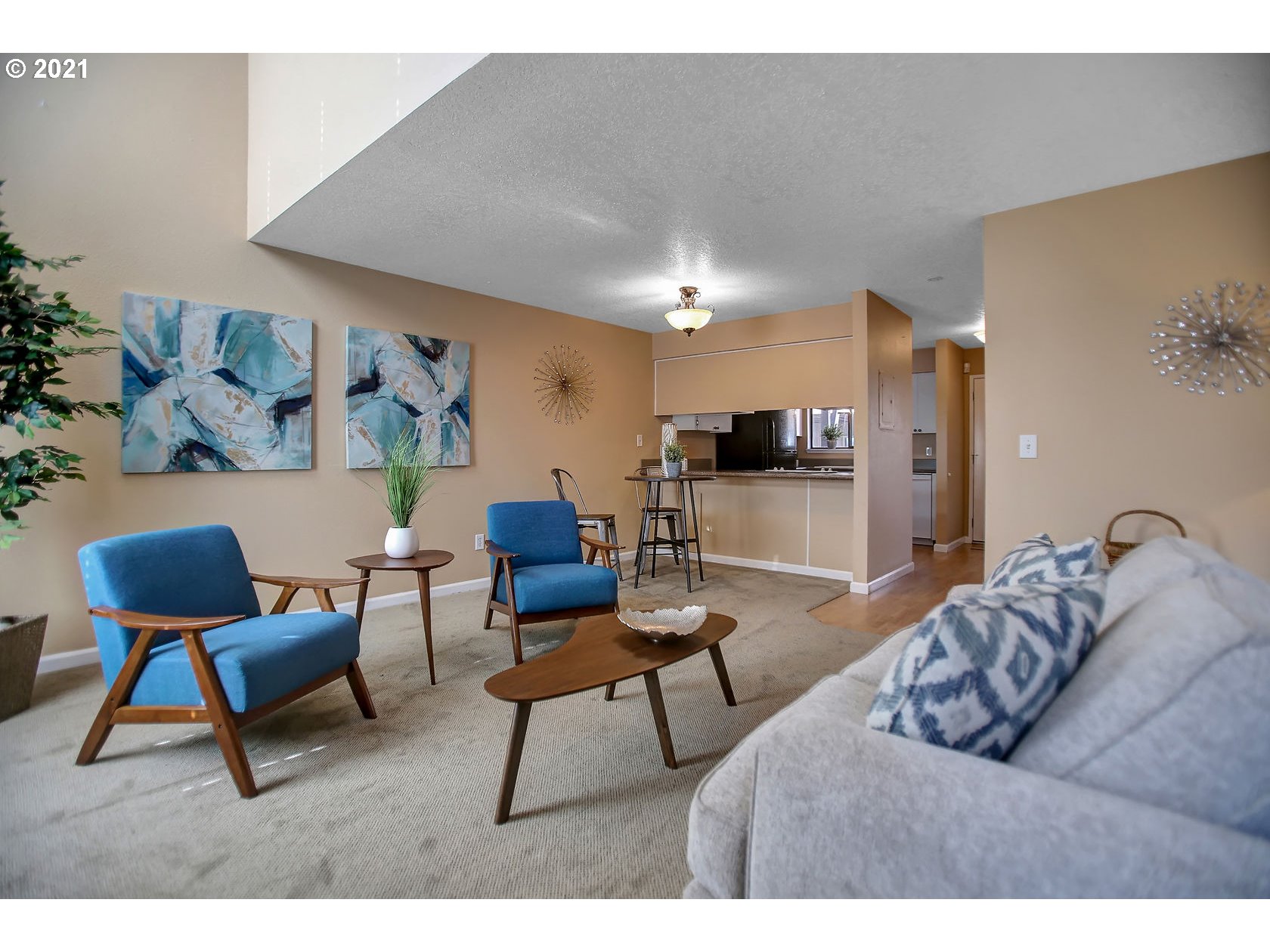 10237 Southwest Denney Road Beaverton, OR 97008 - Photo 8 of 32 a living room with furniture and a flat screen tv
