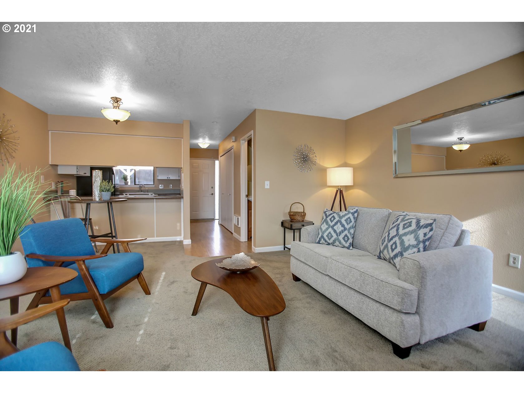 10237 Southwest Denney Road Beaverton, OR 97008 - Photo 9 of 32 a living room with furniture and a rug