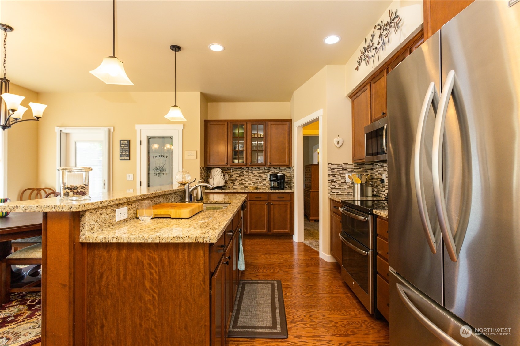1563 Bryce Park Loop Lynden, WA 98264 - Photo 12 of 32 a kitchen with stainless steel appliances granite countertop a refrigerator a oven and a sink