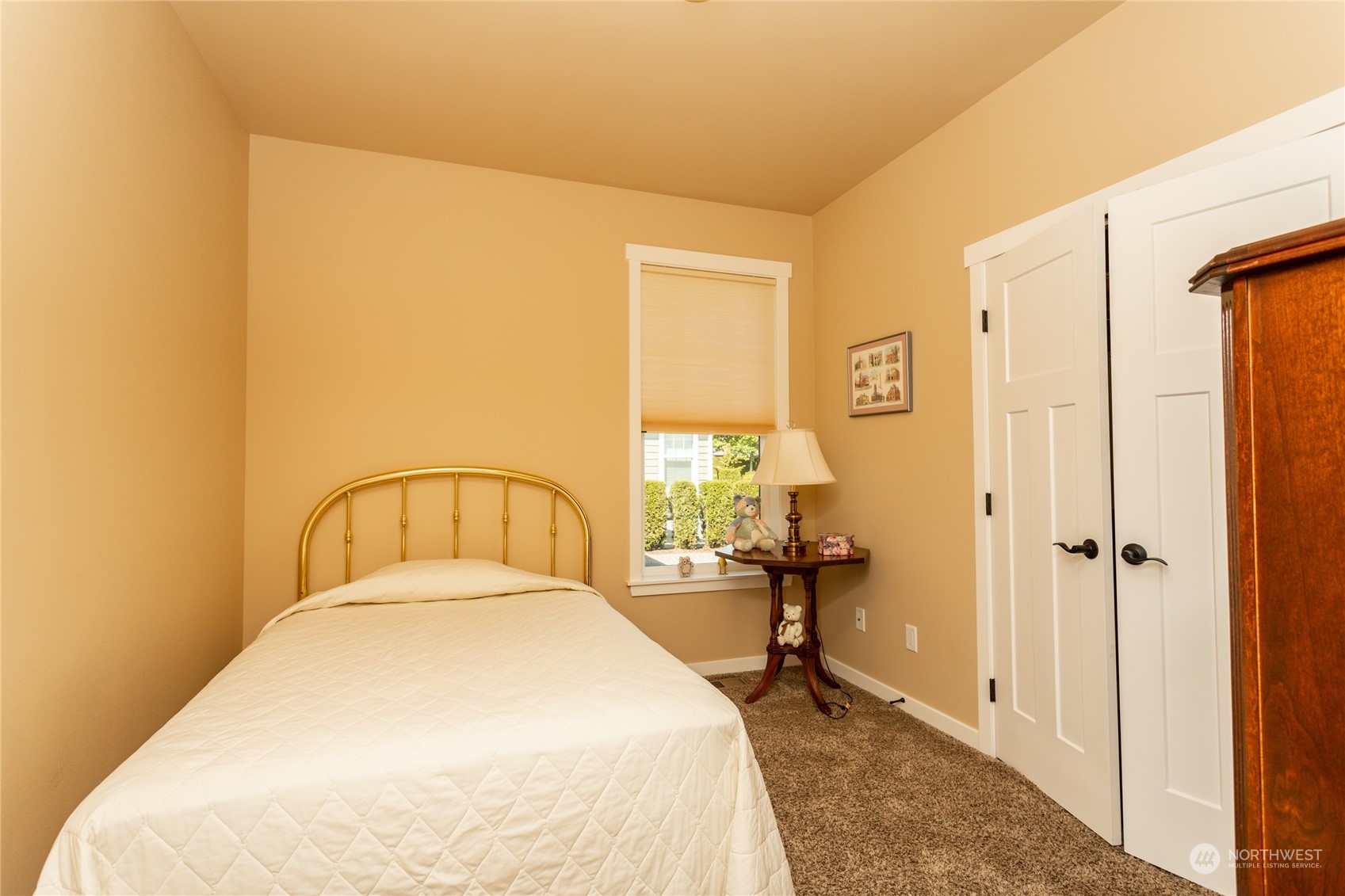 1563 Bryce Park Loop Lynden, WA 98264 - Photo 15 of 32 a spacious bedroom with a bed and a table