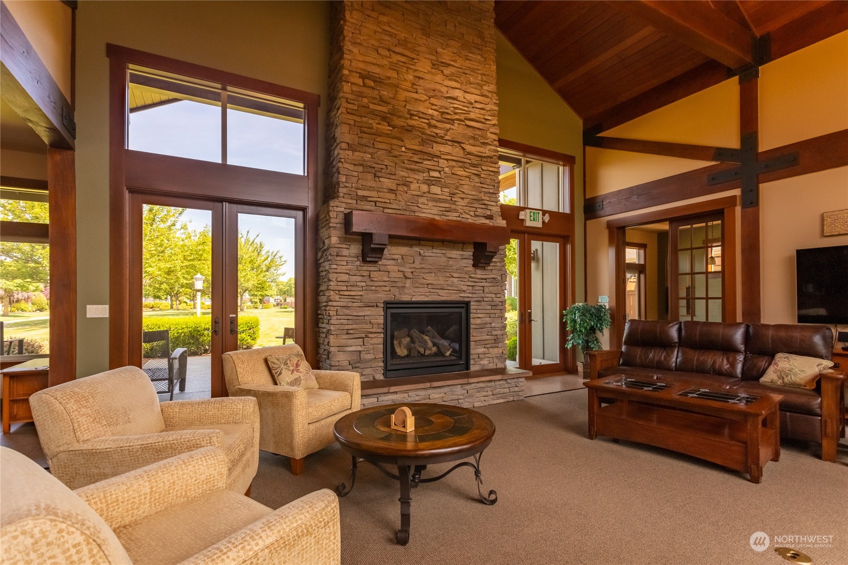 1563 Bryce Park Loop Lynden, WA 98264 - Photo 27 of 32 a living room with furniture a fireplace and a large window