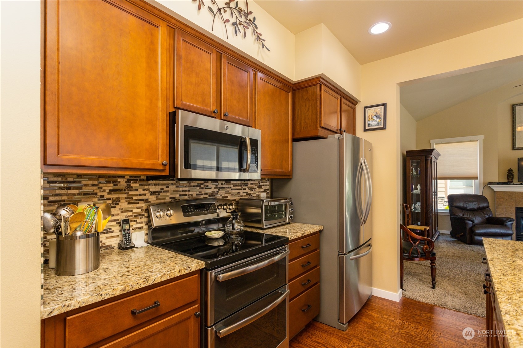 1563 Bryce Park Loop Lynden, WA 98264 - Photo 10 of 32 a kitchen with stainless steel appliances granite countertop a refrigerator stove and sink