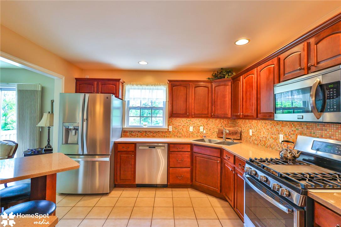 4191 Walter Road Bethlehem, PA 18020 - Photo 8 of 23 A well-equipped kitchen featuring warm wood cabinetry and a functional layout.