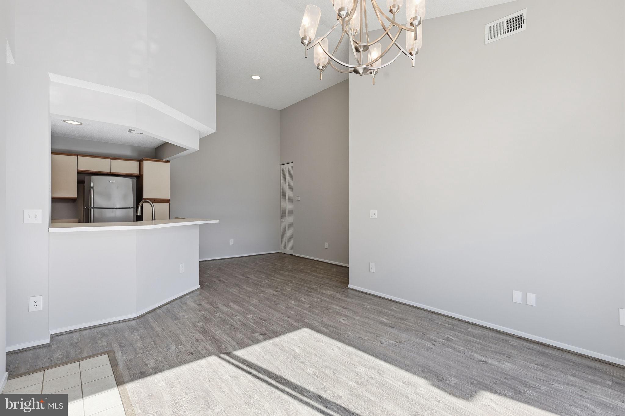 1508 Summerchase Court Reston, VA 20194 - Photo 12 of 23 en empty room with wooden floor