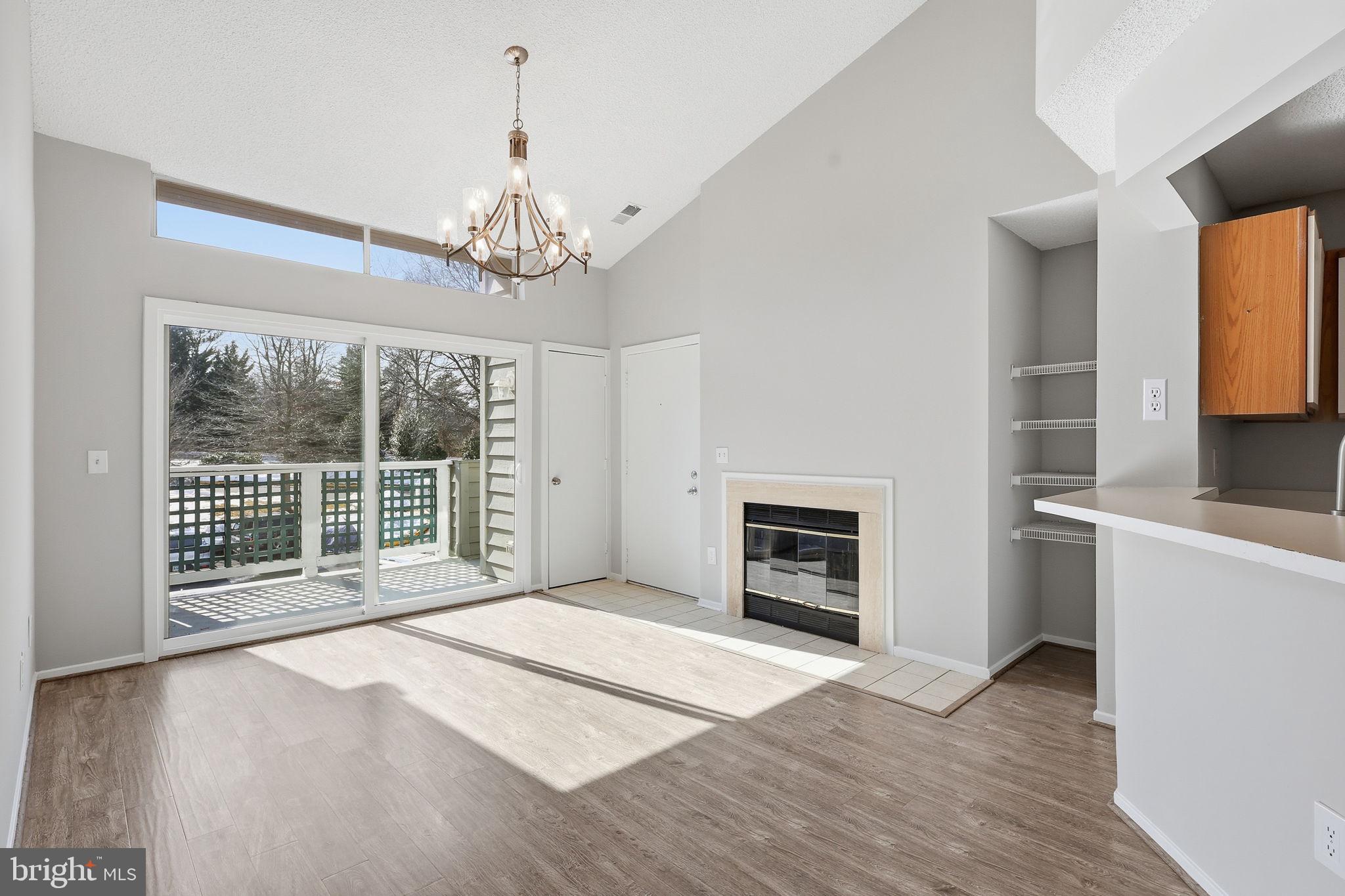 1508 Summerchase Court Reston, VA 20194 - Photo 13 of 23 a view of an empty room with a window and a kitchen