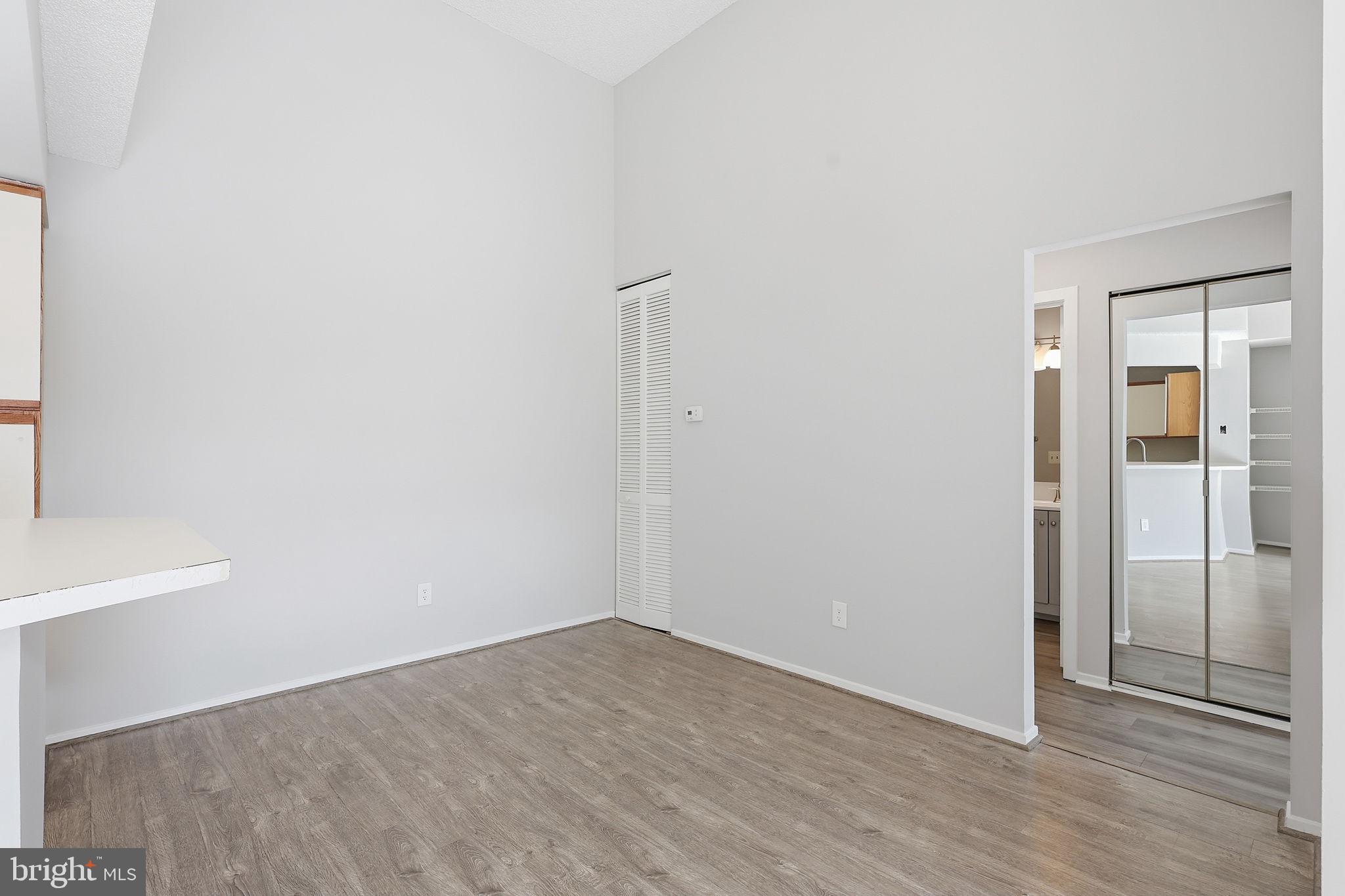1508 Summerchase Court Reston, VA 20194 - Photo 14 of 23 an empty room with wooden floor and windows