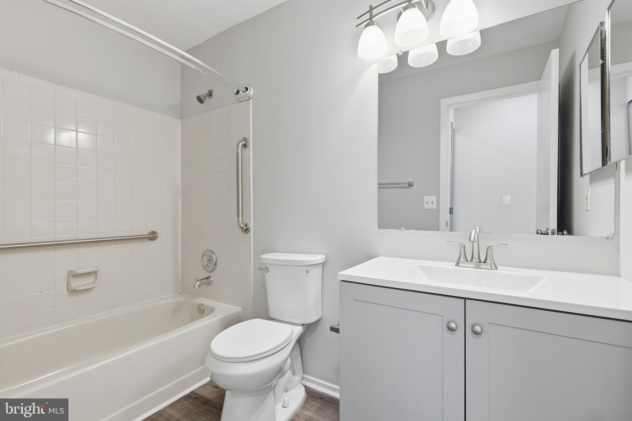 1508 Summerchase Court Reston, VA 20194 - Photo 20 of 23 a bathroom with a sink a toilet a mirror and shower