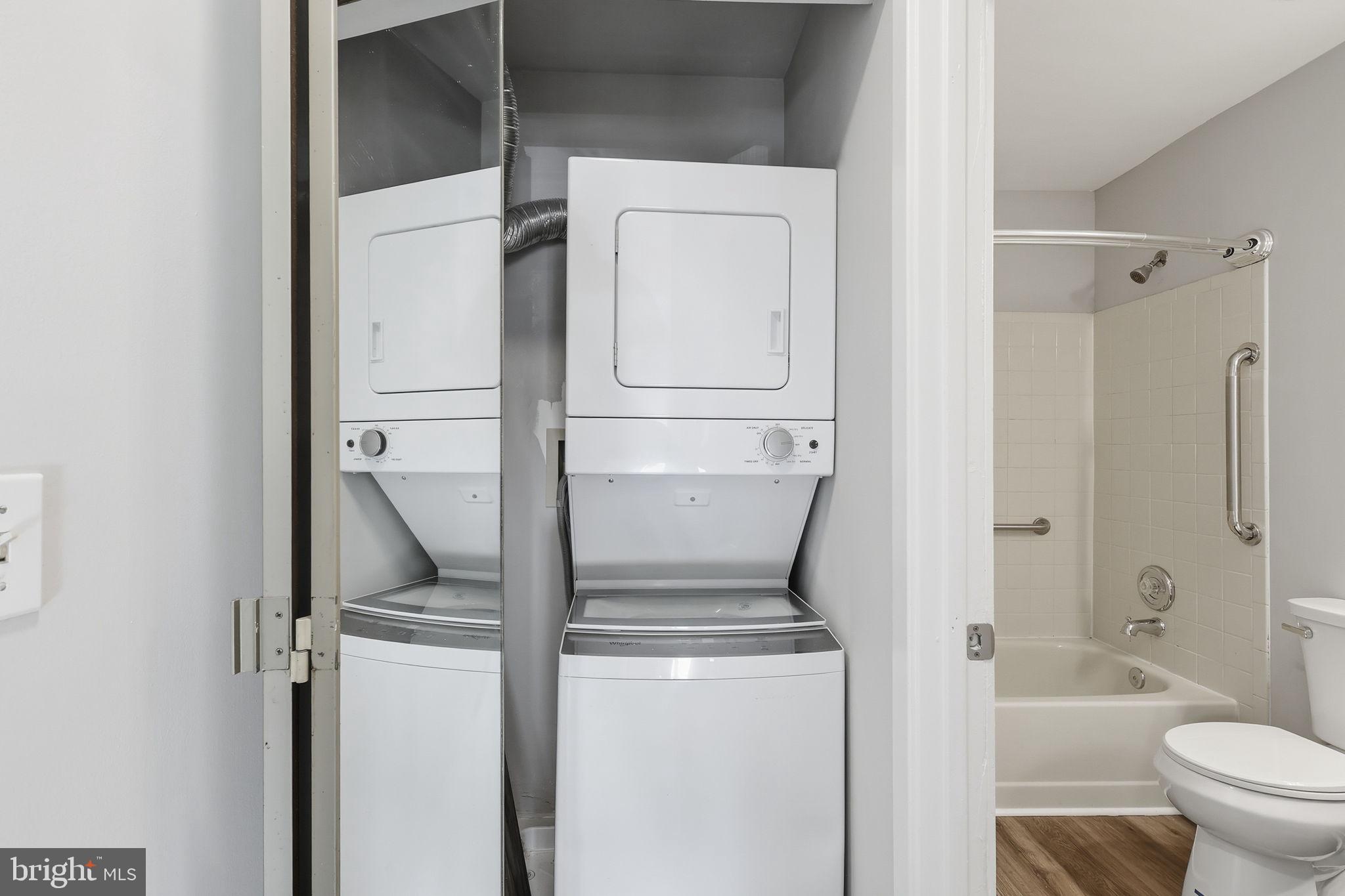 1508 Summerchase Court Reston, VA 20194 - Photo 21 of 23 a bathroom with a granite countertop sink a toilet and shower