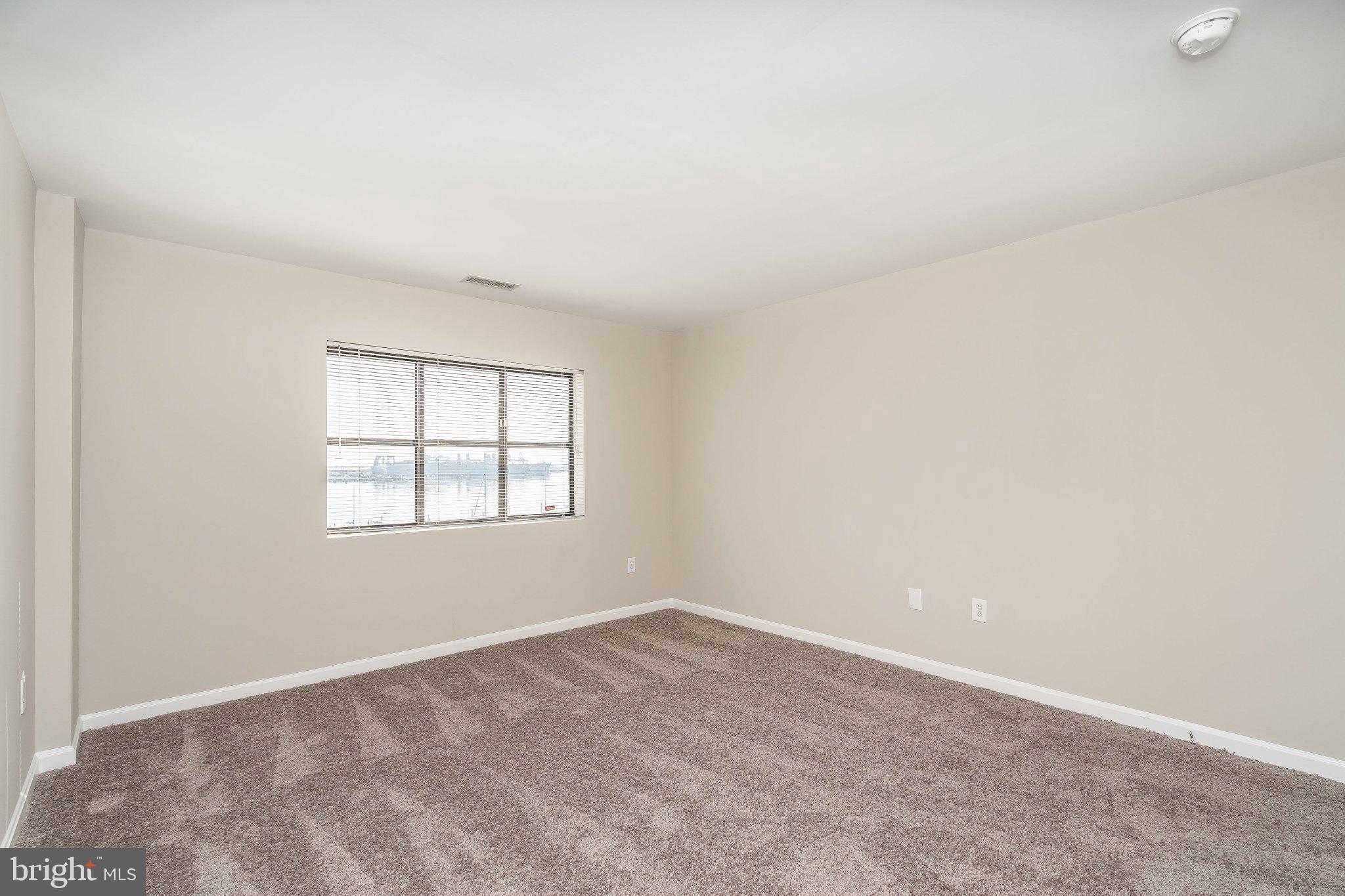 2702 Lighthouse Point East, Unit 532 Baltimore, MD 21224 - Photo 10 of 41 Spacious bed room with natural light.