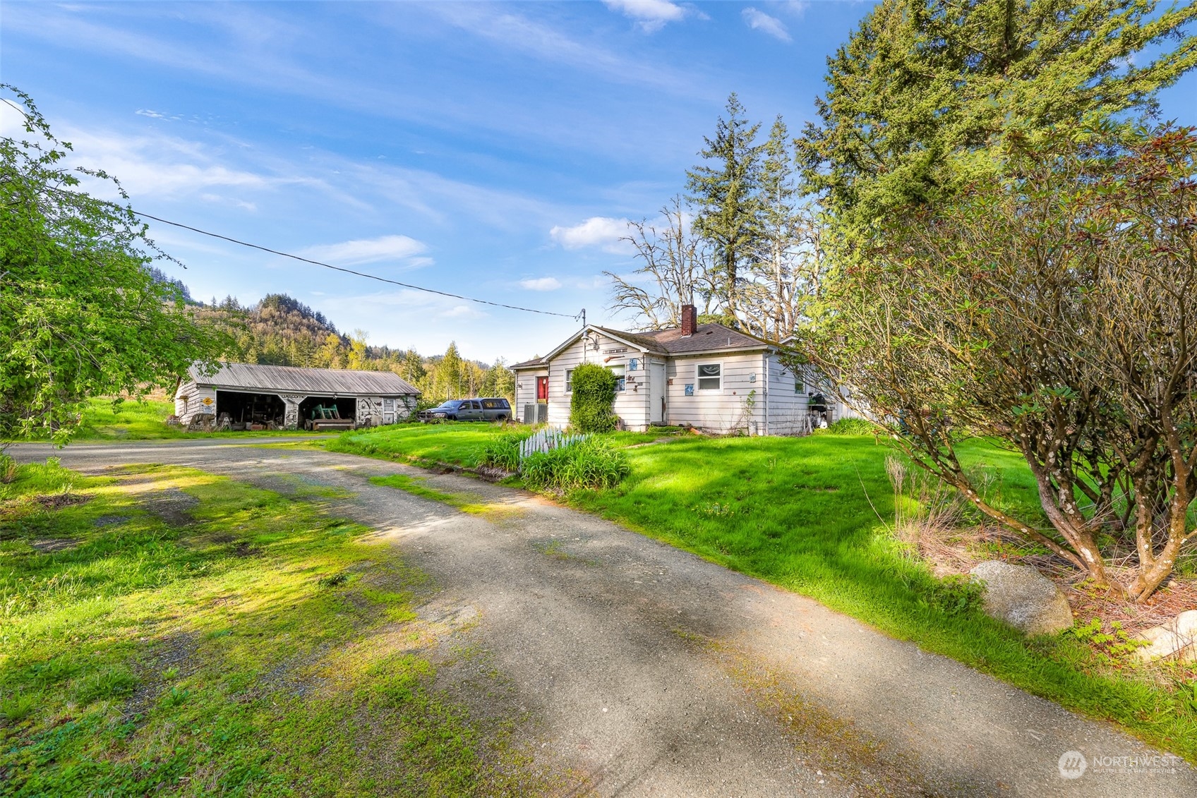 4731 Reese Hill Road Sumas, WA 98295 - Photo 2 of 25 a front view of a house with a yard