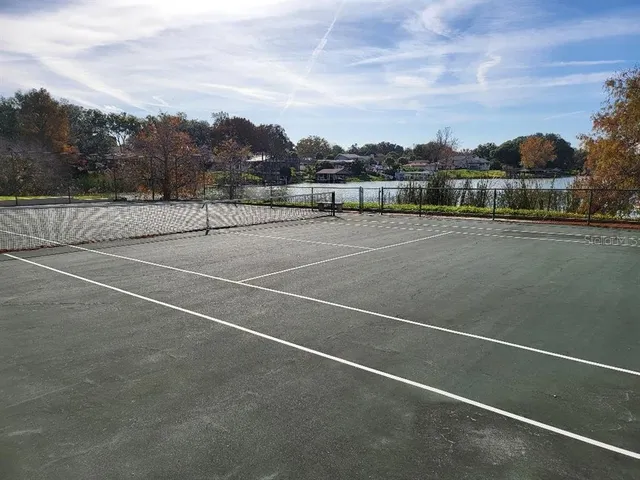 a view of an outdoor space and tennis court